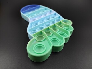 Photo of pop it toys for kids isolated on black background, Not Focus