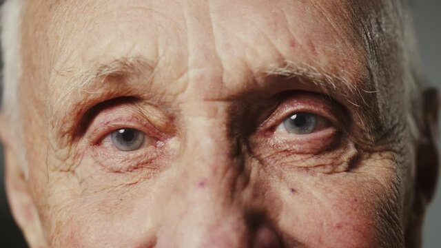Mature man face close-up, senior grandfather eyes, elderly pensioner at home, nursing home, good looking healthy grandpa.