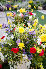 Wedding garden decoration ceremony outdoor. Very beautiful and stylish wedding edge, decorated with various fresh flowers, standing in the garden. Wedding day. Fresh flowers decorations