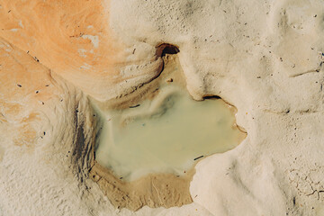 Water hole in rocks in desert after rain