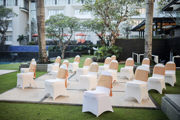 Wedding garden decoration ceremony outdoor. Very beautiful and stylish wedding edge, decorated with various fresh flowers, standing in the garden. Wedding day. Fresh flowers decorations