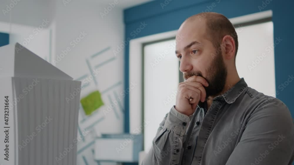 Aufkleber close up of architect thinking about building strategy for construction layout. man engineer brainst