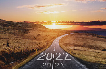 2022 and 2021 on the empty road at sunset. New Year concepts	
