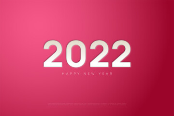 Fototapeta na wymiar 2022 happy new year with pressed numbers on pink paper