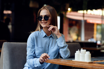 Business woman in a cafe outdoors fresh air summer