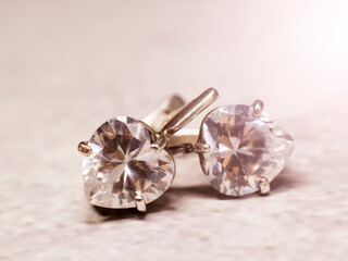 Silver diamond earrings, heart shape, Macro