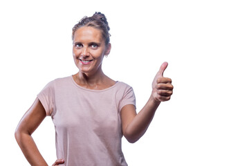 smiling adult woman showing thumb up on a white background