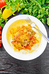 Chicken with pepper in white plate on board top
