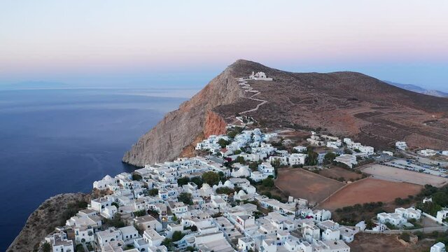 Aerial panoramic view Beautiful typical white houses City Landscape at Sunset, Greece