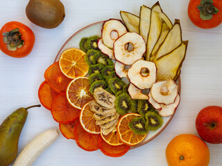 Healthy homemade fruit chips from apple, orange, banana, pear, watermelon, kiwi
