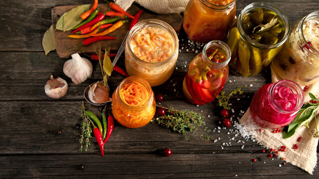 Fermented food on wooden table. High source of probiotics. Front view, copy space