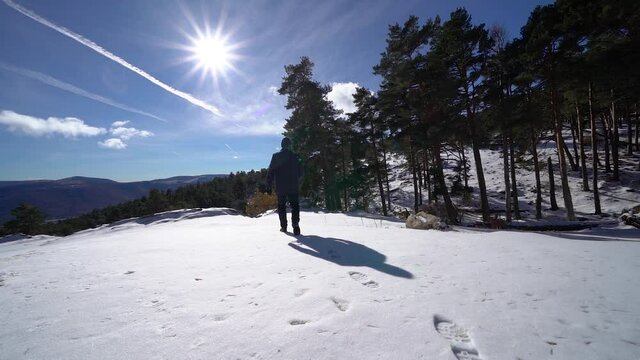 Man leaving footprints on the freshly fallen snow on the mountain. Guadarrama Madrid.