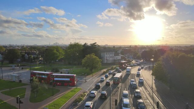 Busy multilane road and surrounding buildings against sun