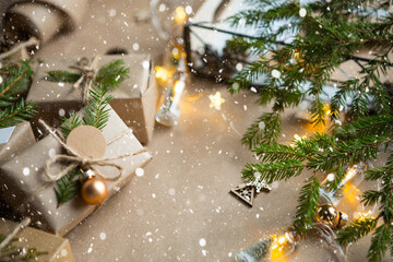 Pack a gift for Christmas and new year in eco-friendly materials: kraft paper, live fir branches,...