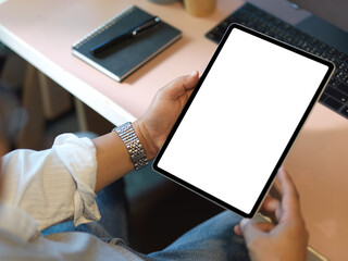 A businessman using digital tablet computer at the desk.