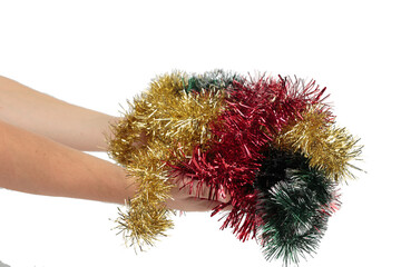 Hands are holding a heap of tinsel.