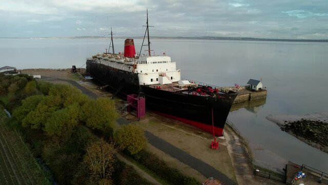 Decaying Rusty TSS Duke Of Lancaster Ship Moored Near Mostyn Docks - aerial orbit