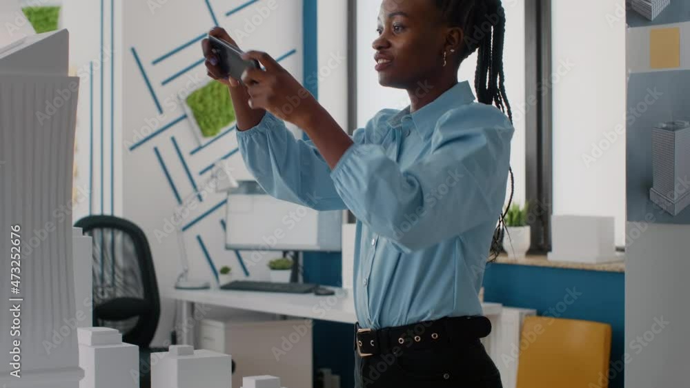 Poster close up of woman working with mobile phone to design building model and maquette. architectural wor