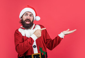 Fototapeta na wymiar santa claus bearded man wish happy new year and merry christmas holiday ready to celebrate winter party with fun and joy full of xmas presents and gifts, presenting product