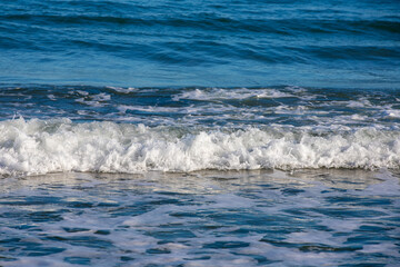 a small wave on the beach
