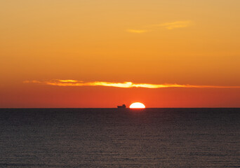Fototapeta na wymiar a beautiful sunrise at the seaside