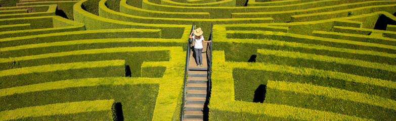 girl in green botanical labyrinth
