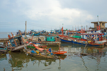 Many fishing boats at the fishing port in Thailand.