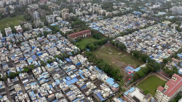 Empty Park In Midst Of Crowded Houses In Mumbai Suburban District, Maharashtra, India. - aerial
