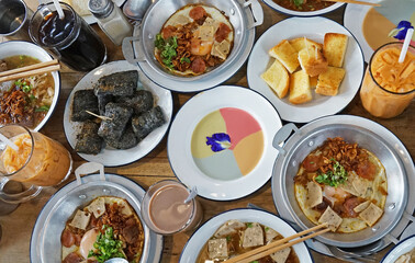 Vietnamese noodle Pho, Indochina pan fried eggs with toppings and custard bread with colorful jam