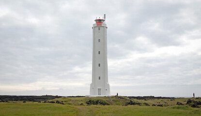 Fototapeta na wymiar White lighthouse on the west coast of Iceland