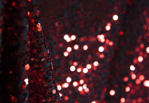 Bright Red Sequin Fabric. Bokeh Effect