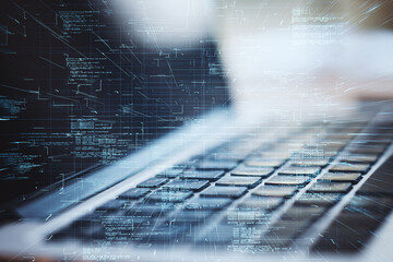 Close up of laptop with abstract glowing coding big data interface on blurry background. Technology and futuristic network. Double exposure.