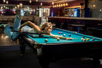 happy woman spend free time at pub, playing in snooker