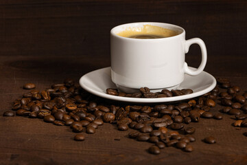 Cup of coffee on brown background