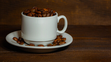Cup of coffee on brown background