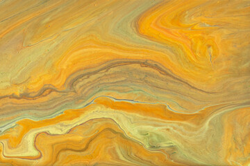 Abstract fluid art background bright orange and yellow colors. Liquid marble. Acrylic painting with ocher gradient.