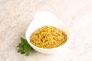Grain mustard sauce in the bowl