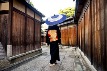 Asian woman with yukata walking in Kyoto, Japan