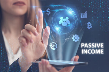 Business, Technology, Internet and network concept. Young businessman working on a virtual screen of the future and sees the inscription: Passive income