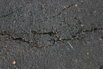 road asphalt texture that breaks due to vehicle vibrations that pass through the load capacity of the asphalt