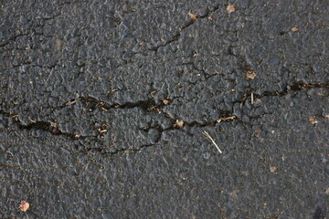 road asphalt texture that breaks due to vehicle vibrations that pass through the load capacity of the asphalt