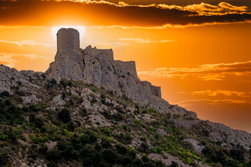 Cathar medieval fortress Queribus from the foot of the mountain in the summer. Languedoc, Occitania, France. - obrazy, fototapety, plakaty