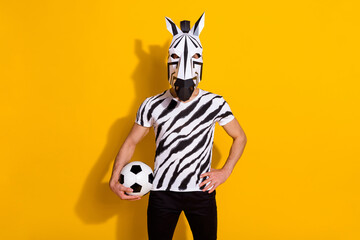 Photo of unusual guy in zebra mask hold ball train national team final cup isolated over bright...