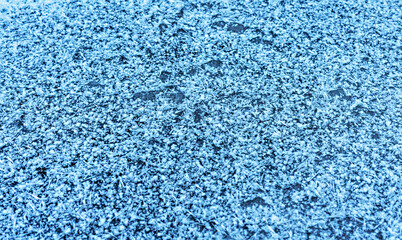 Natural winter background with ice , snow crystals and snowflakes copy space Frost patterns, frozen surface of water on the lake