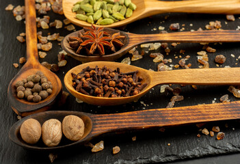 Spices selection over dark wooden table. Food or spicy cooking concept, Healthy eating Background.