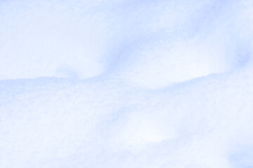 Fototapeta na wymiar Defocused background of fresh snow, abstract winter view 