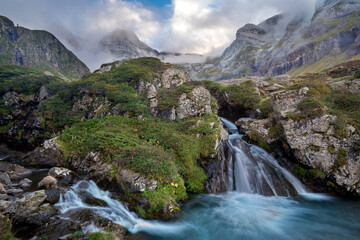 Cascades of the waterfall flowing from the ice circus in the French Pyrenees - obrazy, fototapety, plakaty