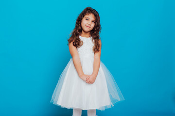 little girl 5 years old in a white princess dress