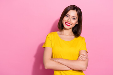 Photo of sweet adorable young lady dressed yellow clothes smiling arms folded isolated pink color background