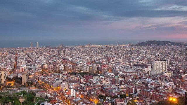 4K day to night time lapse of the Barcelona cityscape at sunset, Spain